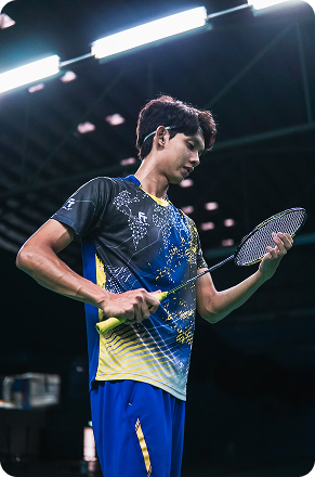 man with badminton racket