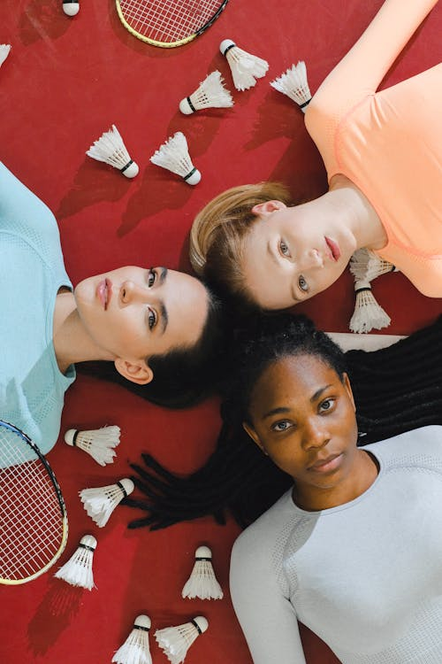 three woman laying on the floor